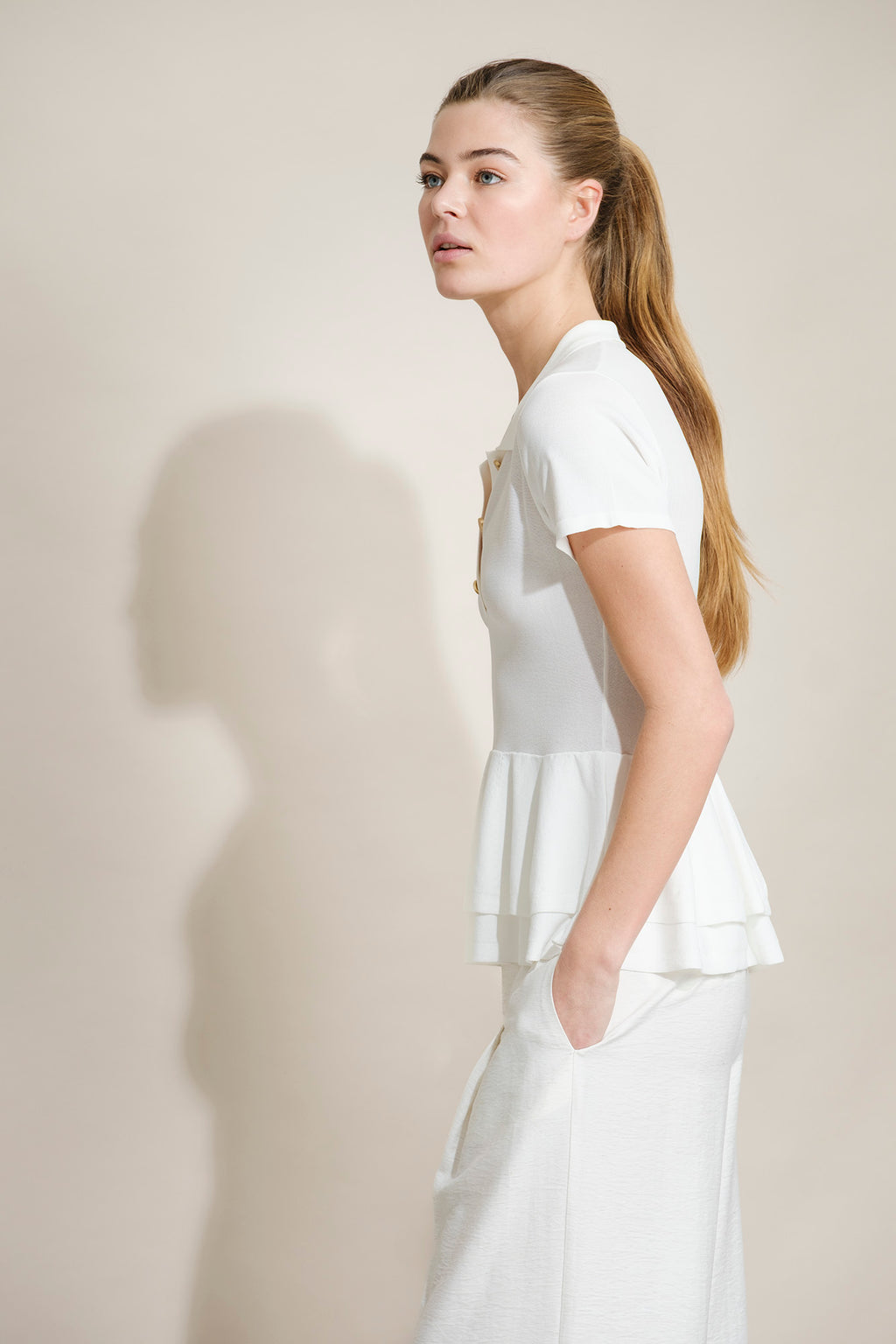POLO DE PUNTO CON PEPLUM