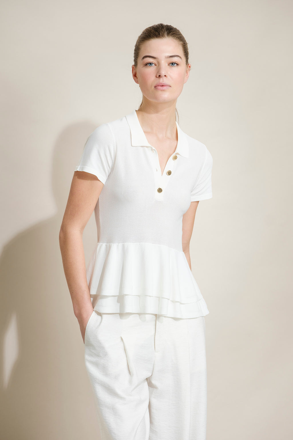POLO DE PUNTO CON PEPLUM