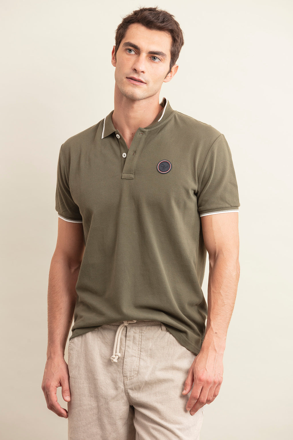 POLO PIQUÉ CON INSIGNIA