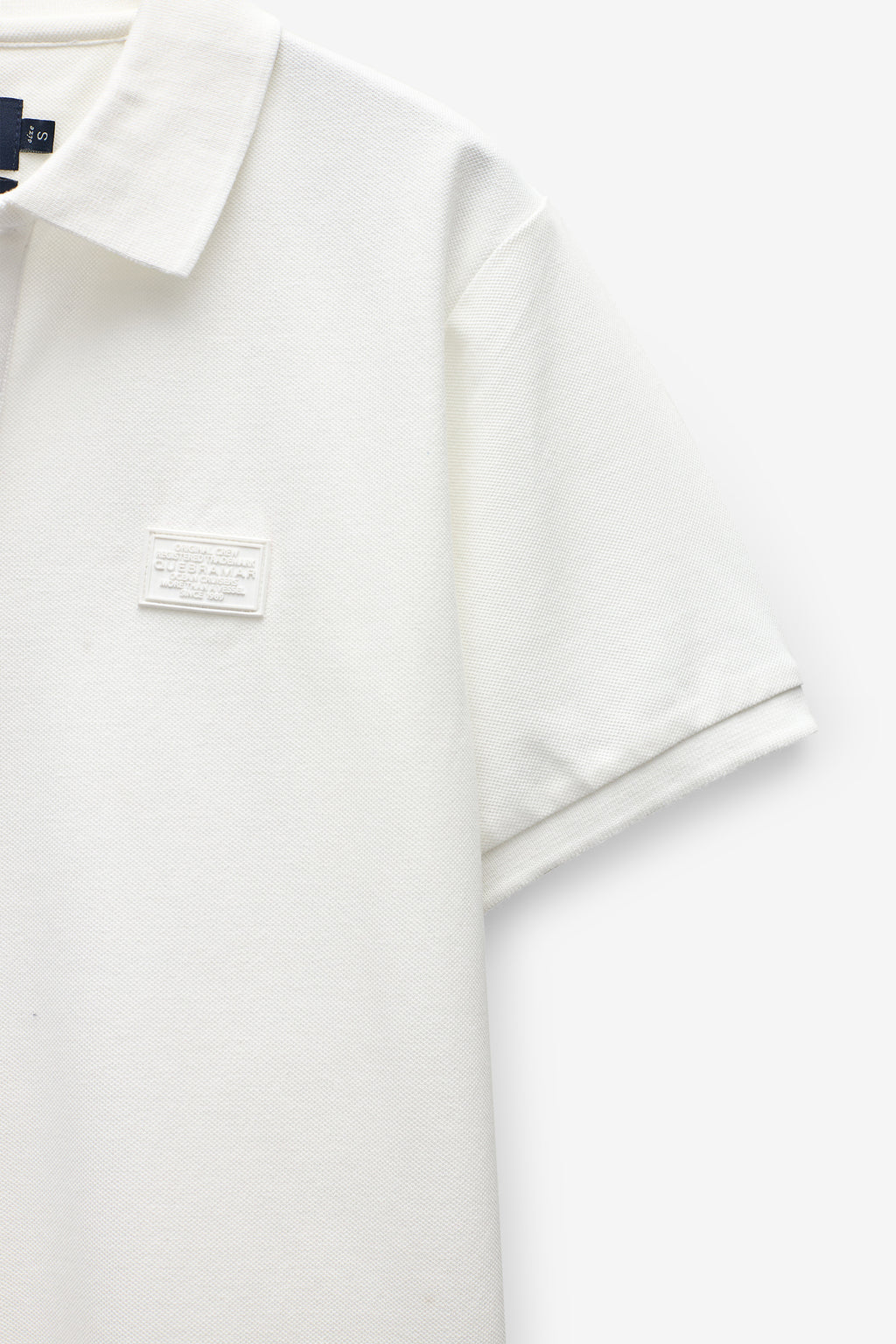 POLO PIQUÉ CON INSIGNIA