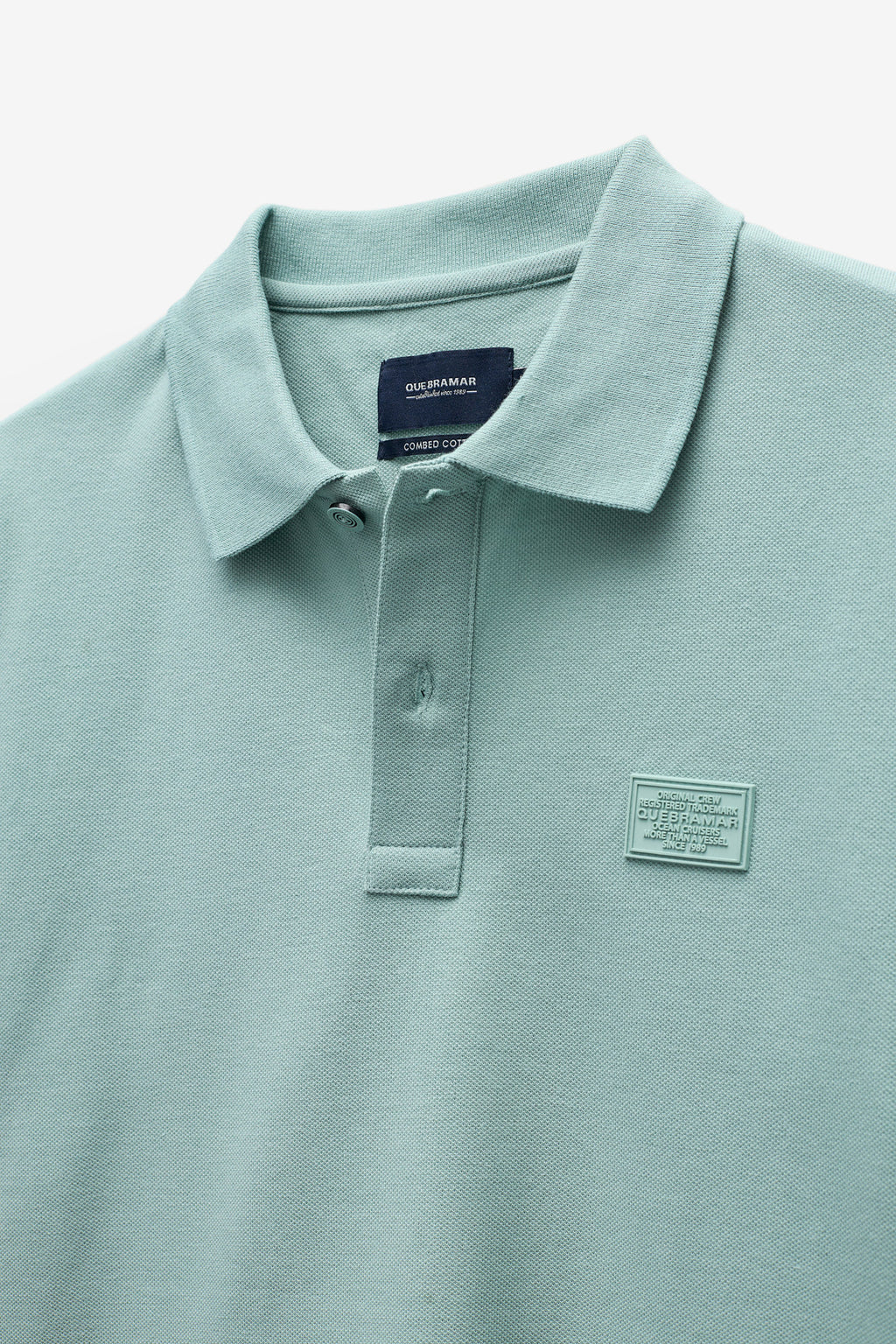 POLO PIQUET CON INSIGNIA