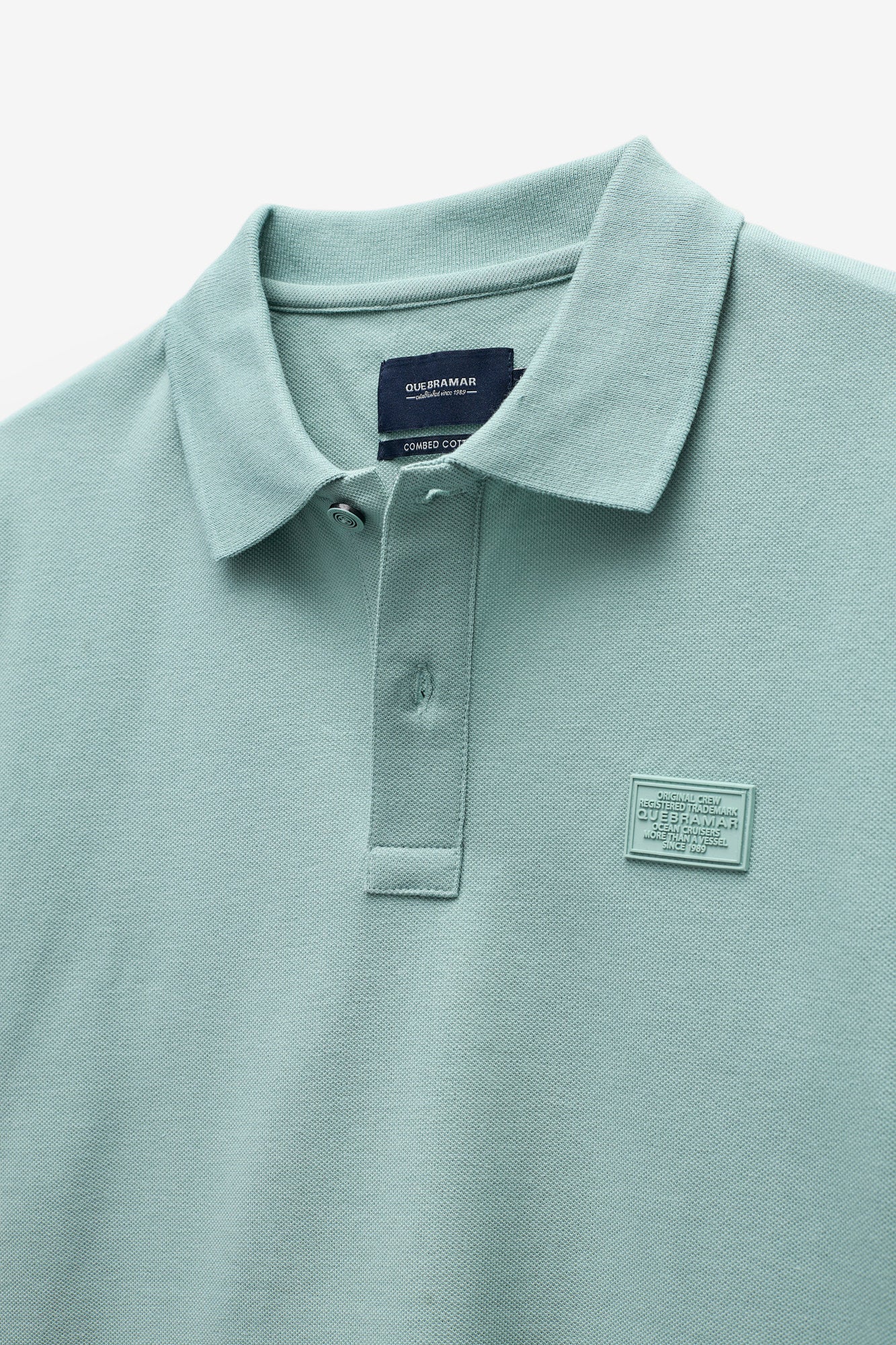 POLO PIQUET CON INSIGNIA