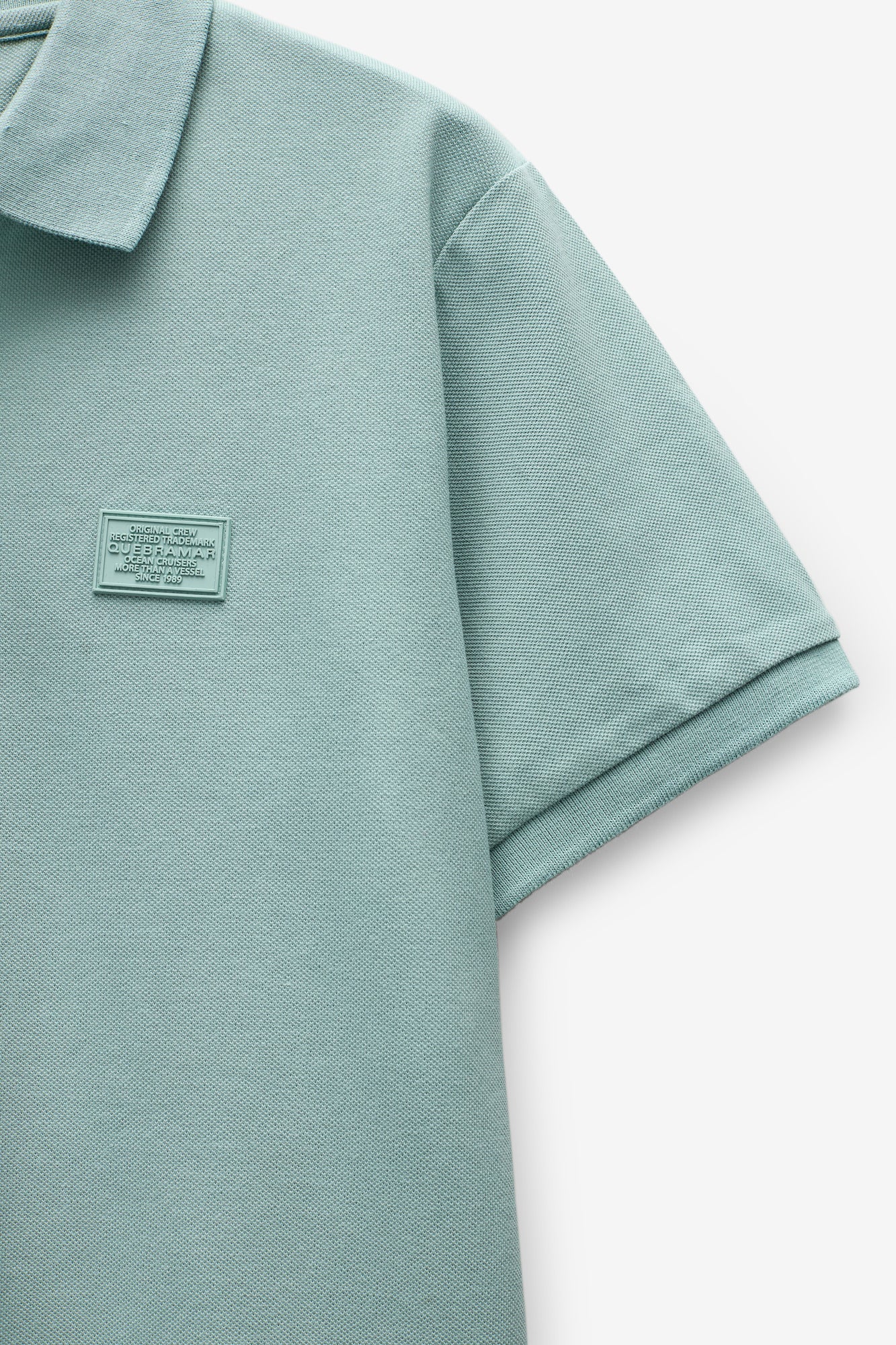 POLO PIQUET CON INSIGNIA