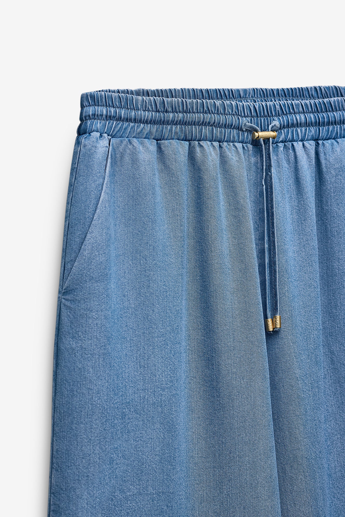 CALÇAS EM CHAMBRAY COM ELÁSTICO NA CINTURA