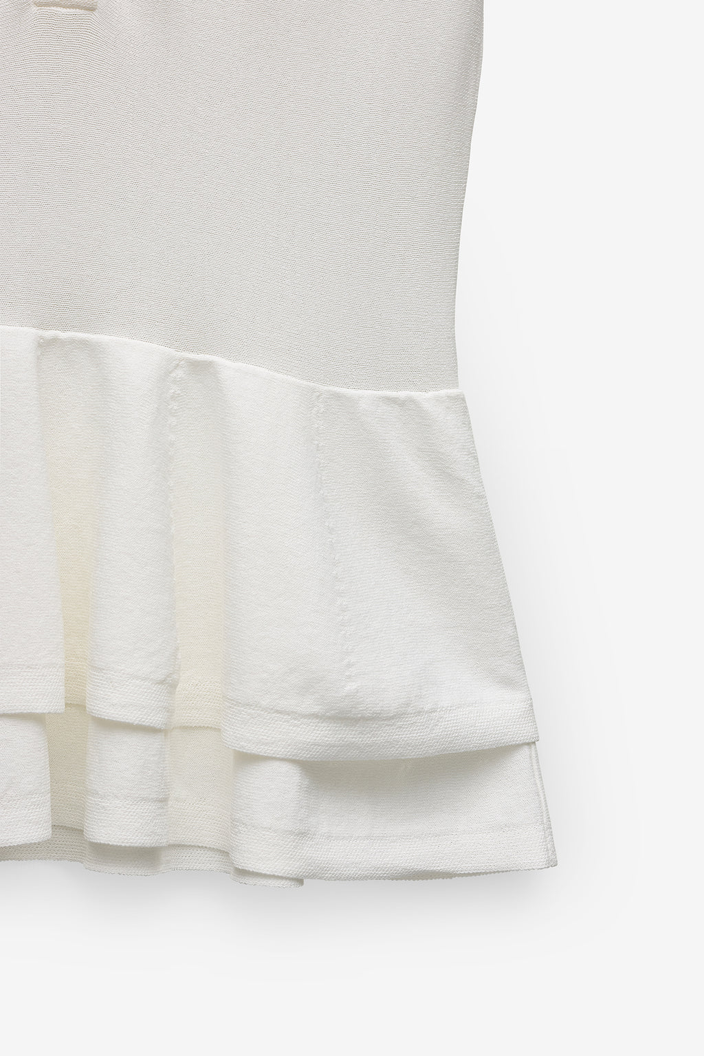 POLO DE PUNTO CON PEPLUM