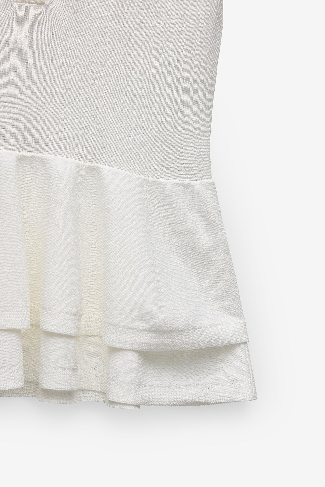 POLO EM MALHA COM PEPLUM